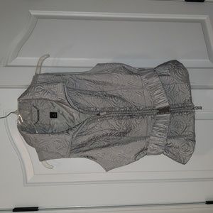 EUC White House Black Market silver vest with ruffle detail. Size M